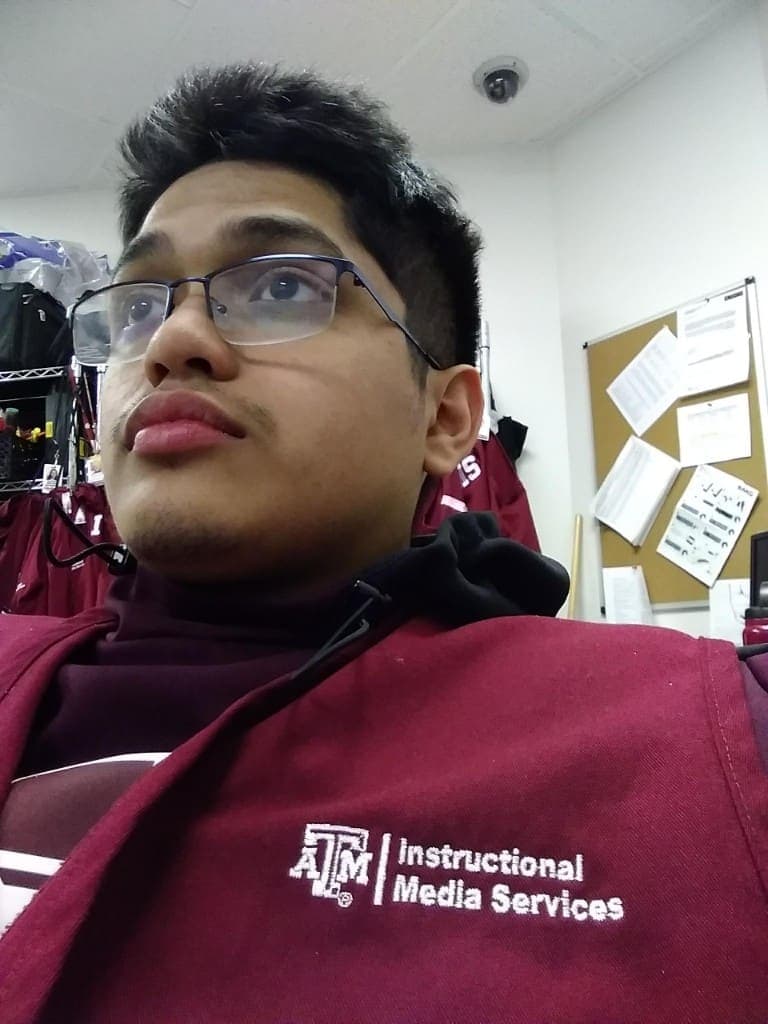 Agustin in a Texas A&M Instructional Media Services vest